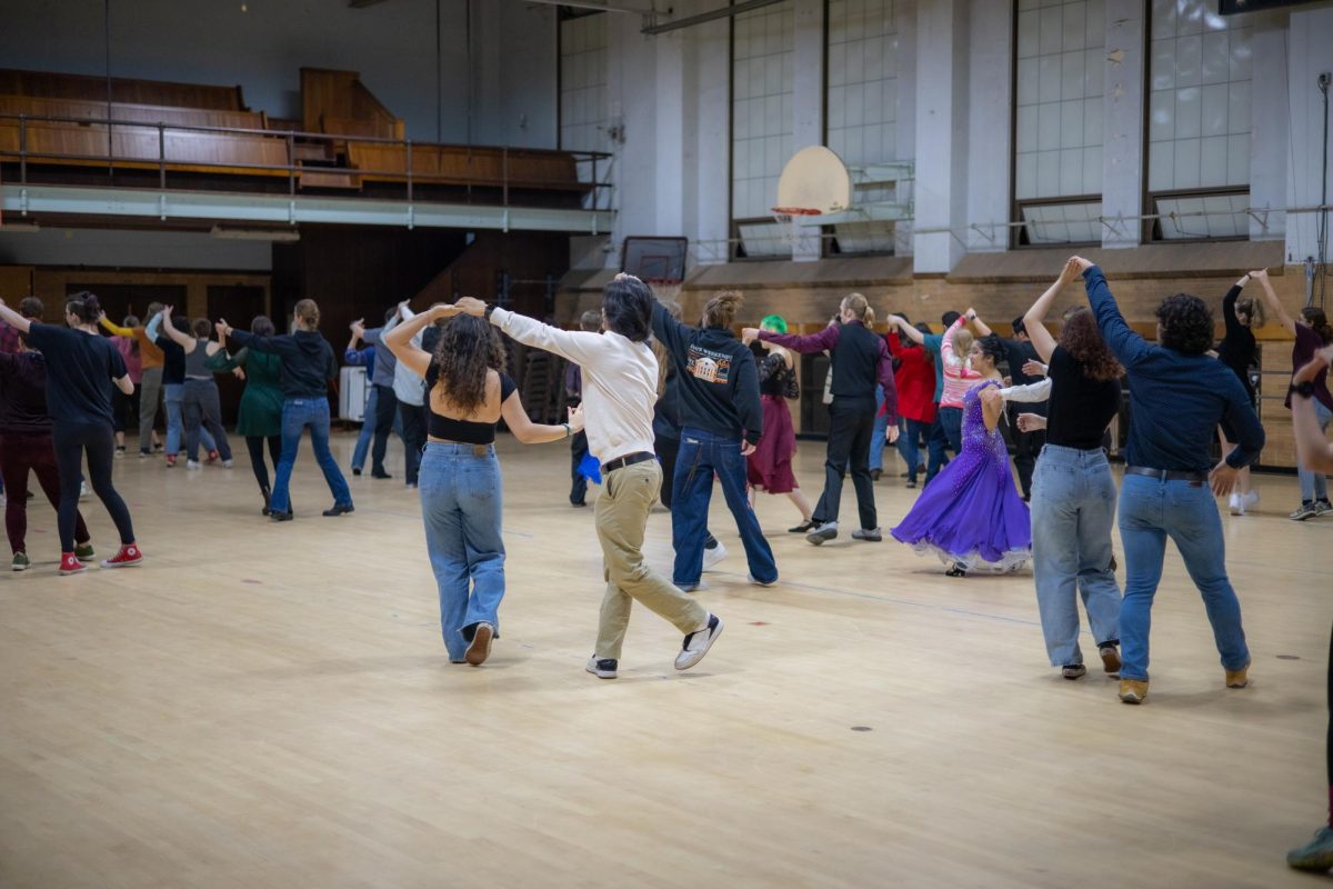 Attendees of the PAC Showcase learning the partner line dance taught by Lila Reid, photographed on Dec 6, 2023 in Womens Building at Oregon State University. The photograph was taken by Jiratana Tungkawachara.