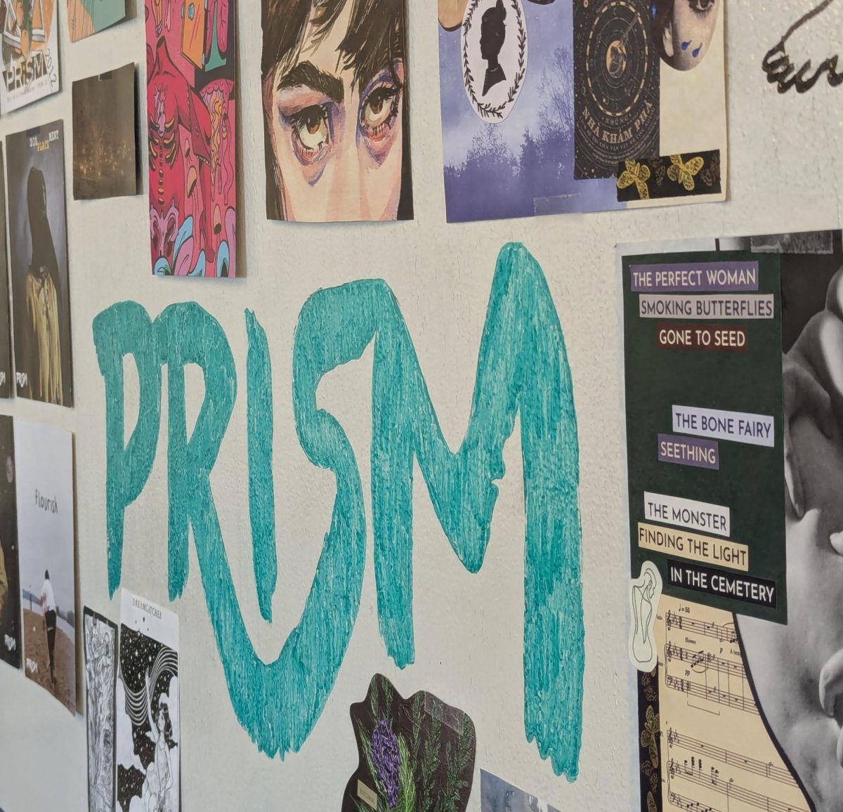 "Prism" logo written on the wall in green ink, surrounded by cut-outs from previous volumes.