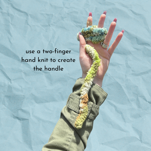 Blue paper texture background with hand showing how to start a two-finger hand knit, text reads "use a two-finger hand knit to create the handle"